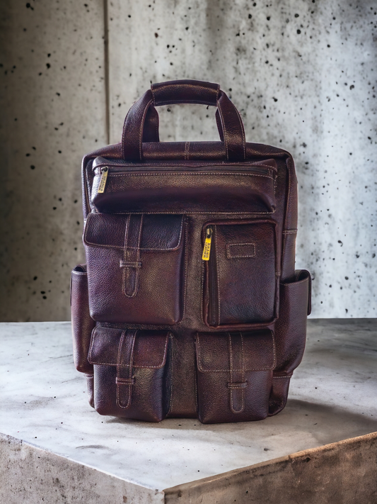 Brown leather unisex backpack with spacious compartments, side pockets, and secure zipper closures. Durable, stylish, and perfect for work, school, or travel.