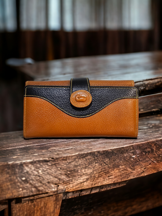 Orange and black leather women's wallet with magnetic closure, 7 card slots, zippered compartments, and photo pocket. Stylish, compact, and practical for everyday use