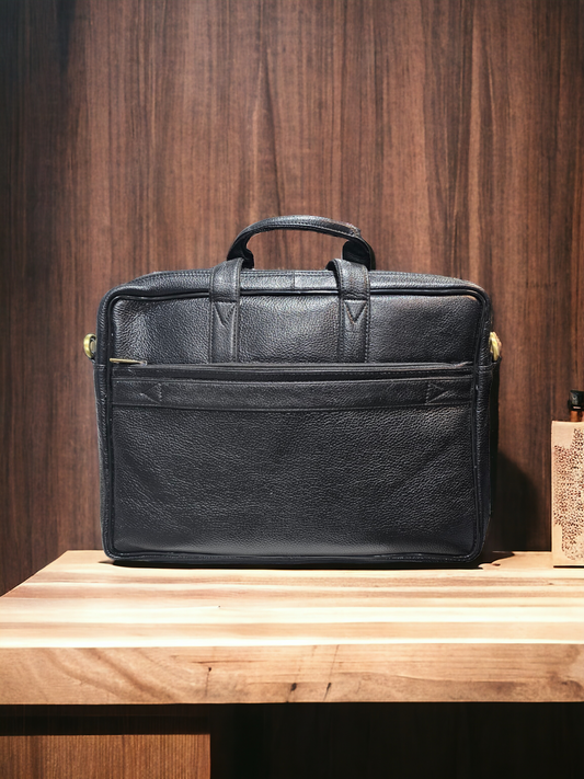 Black leather unisex laptop bag with 15-inch capacity, multiple compartments, and adjustable shoulder strap. Stylish, durable, and ideal for work or school.